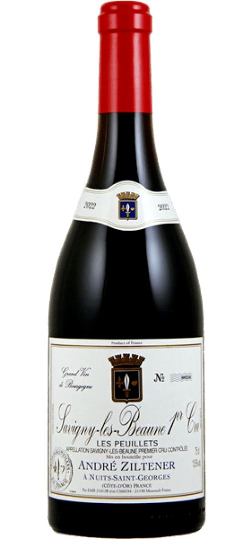 Eine Flasche Rotwein mit der Bezeichnung Savigny-les-Beaune 1er Cru Les Peuillets. Das Etikett zeigt ein Wappen, goldene und schwarze Akzente und den Namen des Erzeugers, André Ziltener, mit einem französischen Text, der den Wein beschreibt.